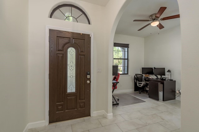 8523 N Newport Ave, Tampa, FL 33604 - entrance foyer featuring a ceiling fan, arched walkways, and baseboards