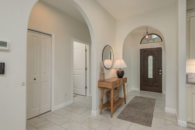 8523 N Newport Ave, Tampa, FL 33604 - foyer entrance featuring arched walkways and baseboards