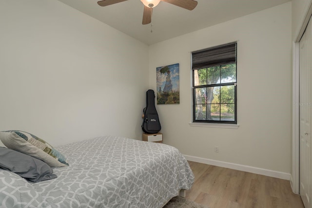 8523 N Newport Ave, Tampa, FL 33604 - bedroom featuring light wood-style floors, baseboards, a closet, and ceiling fan