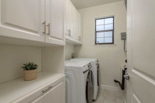 8523 N Newport Ave, Tampa, FL 33604 - laundry room featuring cabinet space, light marble finish flooring, separate washer and dryer, and baseboards