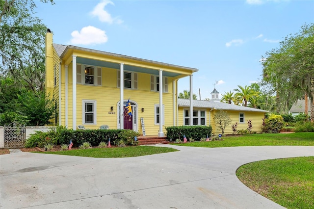 1226 SE 9th Ave, Ocala, FL 34471 - neoclassical home with a chimney and covered porch
