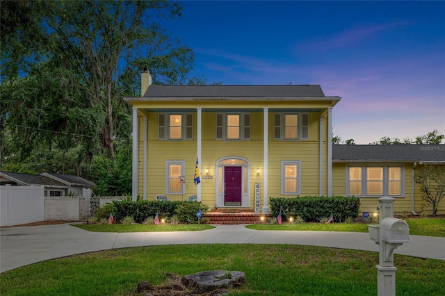 1226 SE 9th Ave, Ocala, FL 34471 - greek revival inspired property featuring a chimney and concrete driveway
