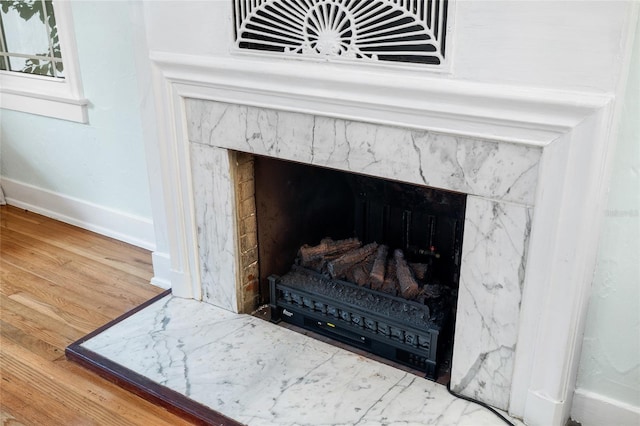1226 SE 9th Ave, Ocala, FL 34471 - detailed view of a fireplace, wood finished floors, and baseboards