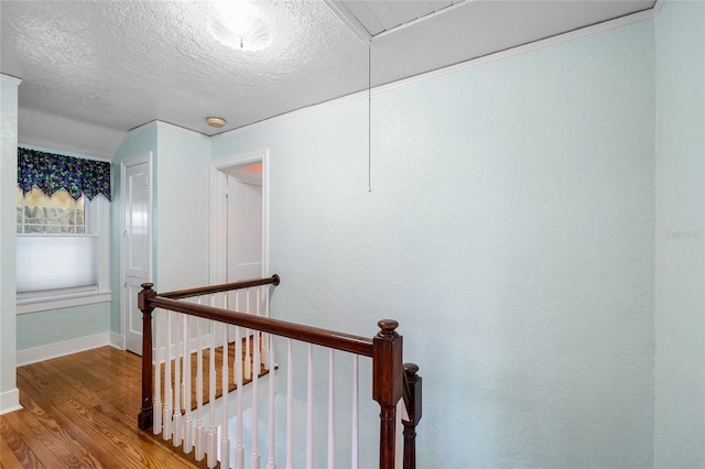 1226 SE 9th Ave, Ocala, FL 34471 - stairs with wood finished floors, attic access, a textured ceiling, and baseboards
