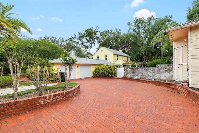 1226 SE 9th Ave, Ocala, FL 34471 - view of front of property with a garage and decorative driveway