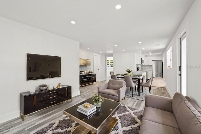 1119 Eau Claire Cir, Tampa, FL 33619 - living area featuring light wood-type flooring, recessed lighting, and baseboards