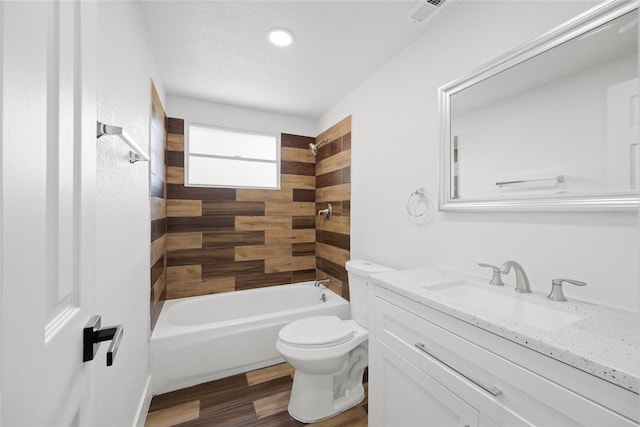 1119 Eau Claire Cir, Tampa, FL 33619 - full bath featuring vanity, toilet, wood finished floors, shower / washtub combination, and recessed lighting
