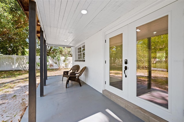 1119 Eau Claire Cir, Tampa, FL 33619 - view of patio featuring french doors