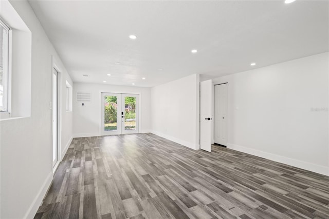 1119 Eau Claire Cir, Tampa, FL 33619 - unfurnished room with recessed lighting, wood finished floors, baseboards, and french doors