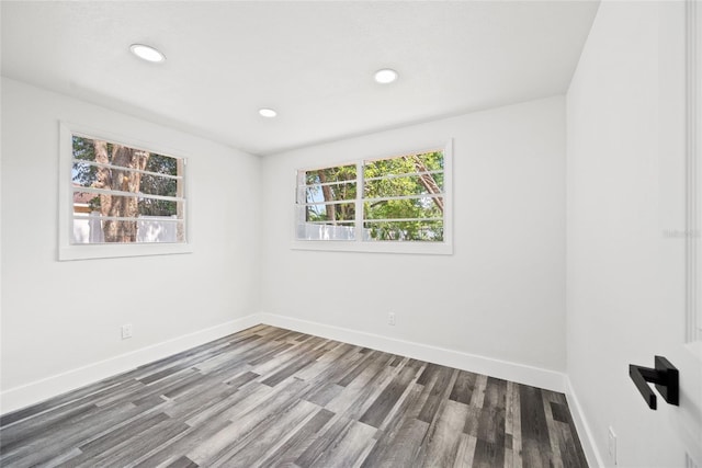 1119 Eau Claire Cir, Tampa, FL 33619 - empty room featuring baseboards, wood finished floors, and recessed lighting