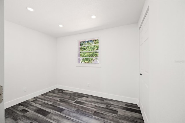 1119 Eau Claire Cir, Tampa, FL 33619 - unfurnished room with recessed lighting, dark wood-style flooring, and baseboards