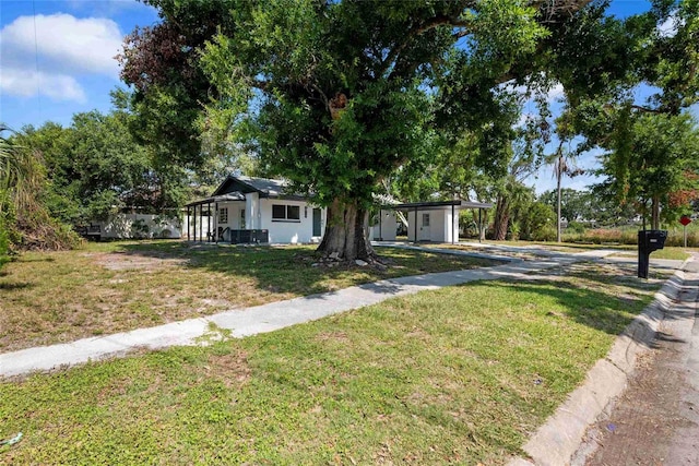 1119 Eau Claire Cir, Tampa, FL 33619 - view of front facade with concrete driveway and a front yard