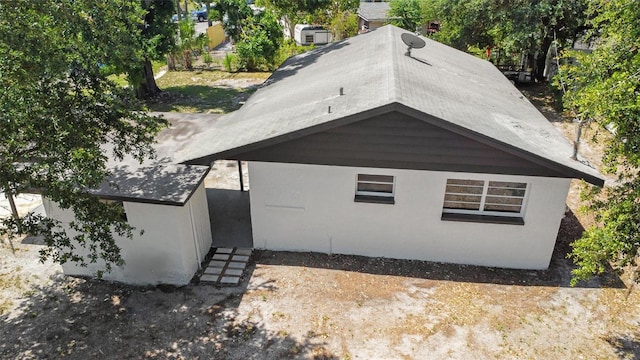1119 Eau Claire Cir, Tampa, FL 33619 - view of side of home featuring stucco siding