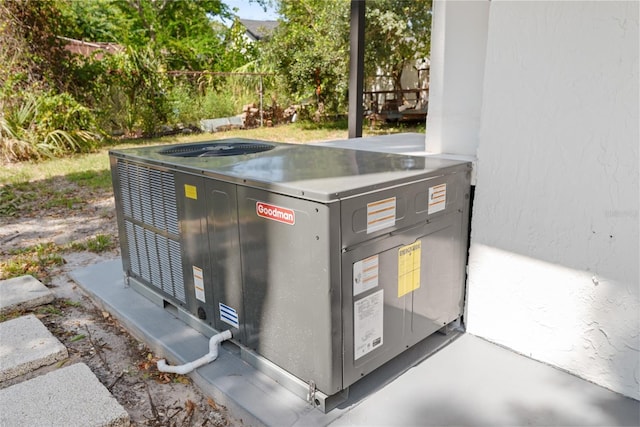1119 Eau Claire Cir, Tampa, FL 33619 - exterior view of central AC unit and stucco siding