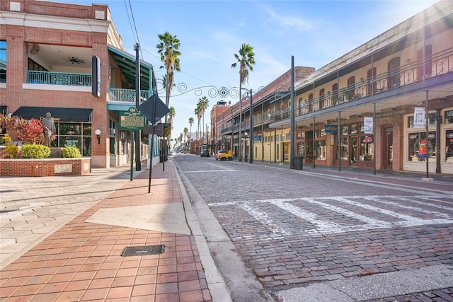 1119 Eau Claire Cir, Tampa, FL 33619 - view of decorative street featuring sidewalks, curbs, and street lights