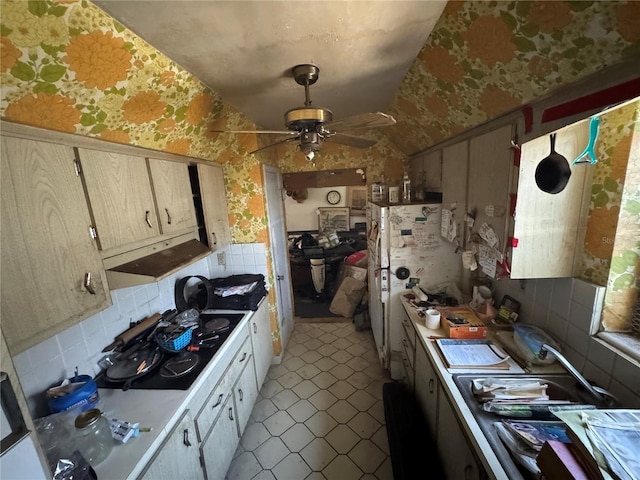 3730 NE 17th Ave, Pompano Beach, FL 33064 - kitchen featuring wallpapered walls, exhaust hood, lofted ceiling, a ceiling fan, and light countertops