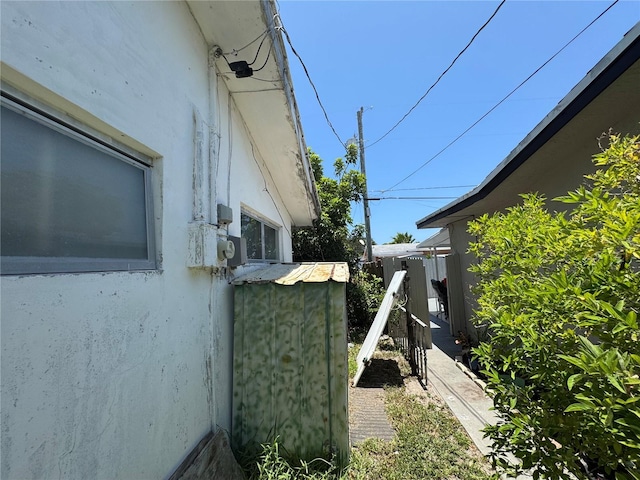 3730 NE 17th Ave, Pompano Beach, FL 33064 - view of side of home featuring stucco siding