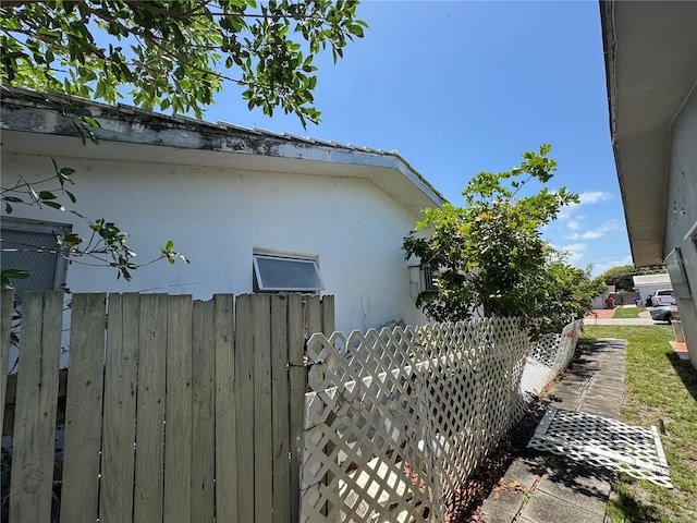 3730 NE 17th Ave, Pompano Beach, FL 33064 - view of side of property with stucco siding