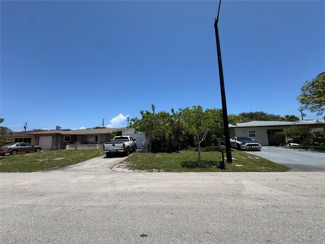 3730 NE 17th Ave, Pompano Beach, FL 33064 - view of front of property with a front yard