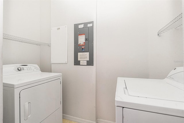 21007 Sunpoint Way Unit 203, Lutz, FL 33558 - washroom with independent washer and dryer, electric panel, and baseboards