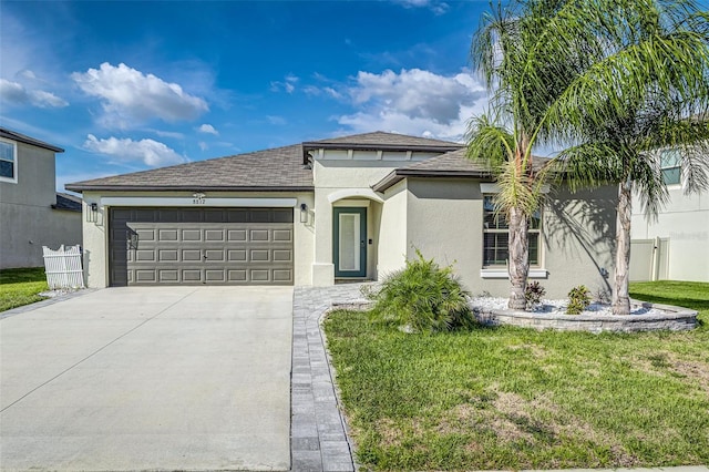 8812 Parsons Hill Blvd, Wesley Chapel, FL 33545 - view of front of home featuring stucco siding, roof with shingles, an attached garage, and driveway
