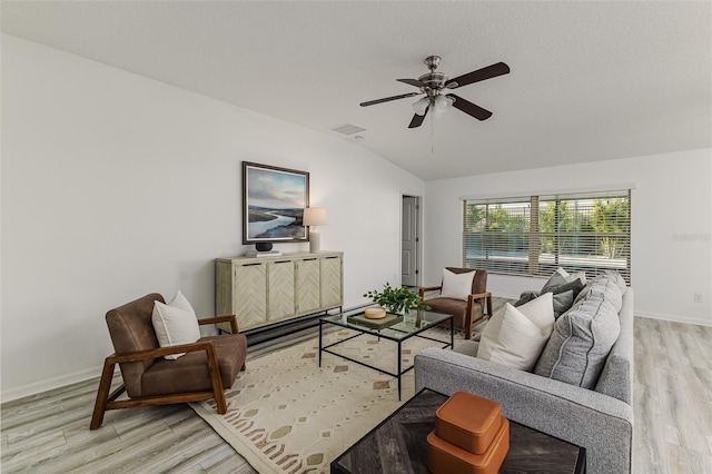 8812 Parsons Hill Blvd, Wesley Chapel, FL 33545 - living room featuring lofted ceiling, light wood finished floors, ceiling fan, and baseboards