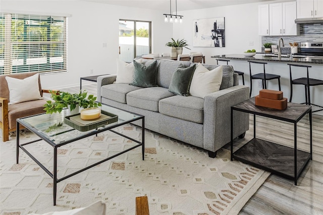 8812 Parsons Hill Blvd, Wesley Chapel, FL 33545 - living area featuring light wood-style flooring