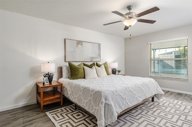 8812 Parsons Hill Blvd, Wesley Chapel, FL 33545 - bedroom featuring light wood finished floors, baseboards, and ceiling fan