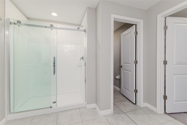 8812 Parsons Hill Blvd, Wesley Chapel, FL 33545 - full bathroom featuring a stall shower, tile patterned floors, and baseboards