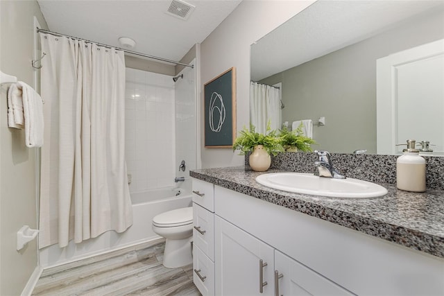 8812 Parsons Hill Blvd, Wesley Chapel, FL 33545 - bathroom with vanity, shower / bath combo, wood finished floors, and toilet