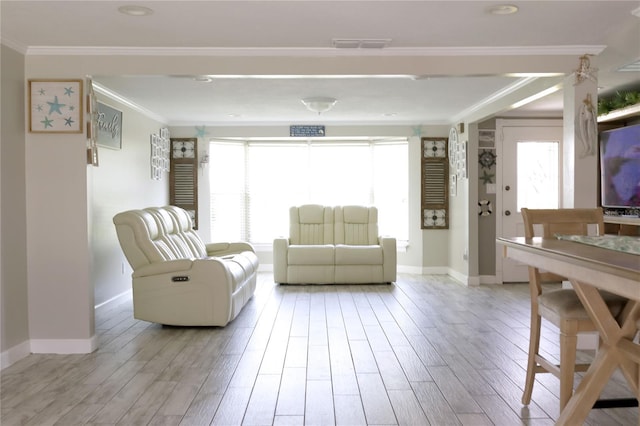 1423 Spruce Rd N, Lakeland, FL 33809 - living area with baseboards, plenty of natural light, light wood-type flooring, and crown molding