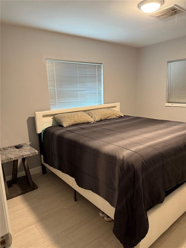 6345 Lambert Ln, New Port Richey, FL 34652 - bedroom featuring attic access