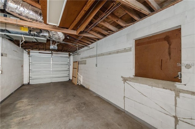 6345 Lambert Ln, New Port Richey, FL 34652 - garage with a garage door opener and concrete block wall