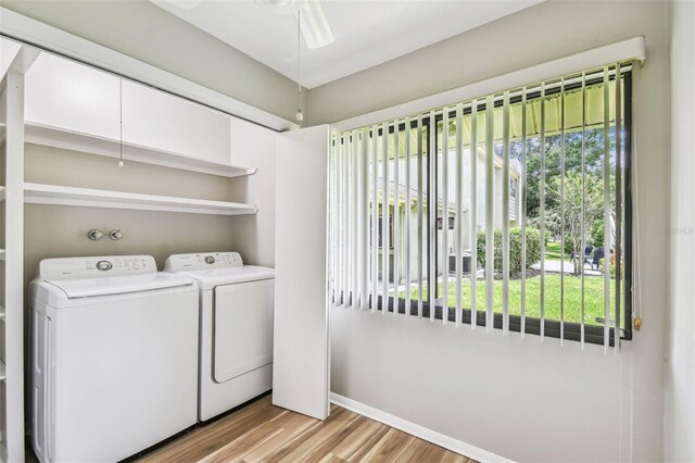 13501 Palmwood Ln Unit 0, Tampa, FL 33618 - laundry room with independent washer and dryer, light wood-style floors, baseboards, and ceiling fan