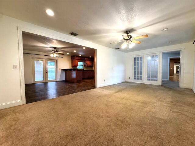 3419 Pearson Rd, Valrico, FL 33596 - unfurnished living room with carpet flooring, a ceiling fan, french doors, baseboards, and recessed lighting