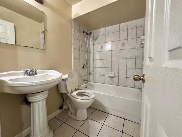 3419 Pearson Rd, Valrico, FL 33596 - full bath featuring toilet, baseboards, tile patterned flooring, tub / shower combination, and a sink