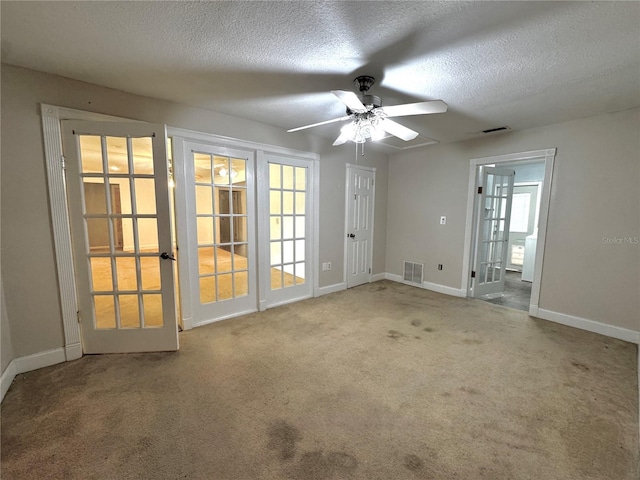 3419 Pearson Rd, Valrico, FL 33596 - carpeted spare room with baseboards, ceiling fan, and a textured ceiling