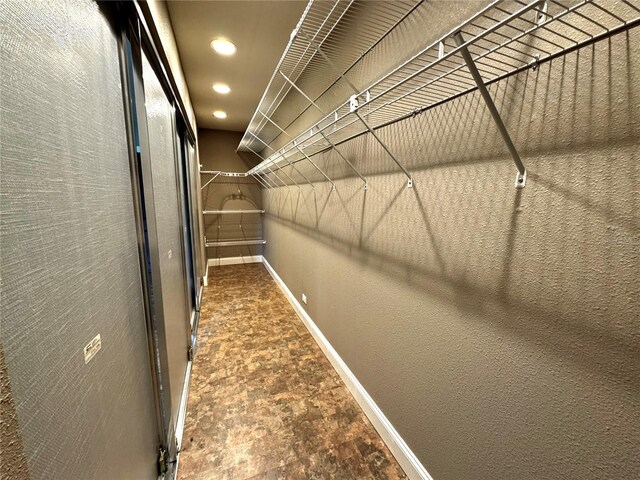 3419 Pearson Rd, Valrico, FL 33596 - walk in closet with stone finish floors