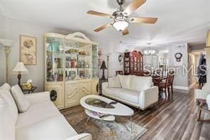 7523 Pitch Pine Cir Unit 184, Tampa, FL 33617 - living room with ceiling fan, dark wood-type flooring, and a chandelier