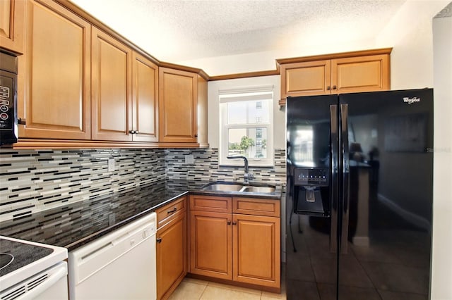 7625 Sun Island Dr S Unit 304, South Pasadena, FL 33707 - kitchen with white appliances, decorative backsplash, light tile patterned floors, a textured ceiling, and brown cabinets