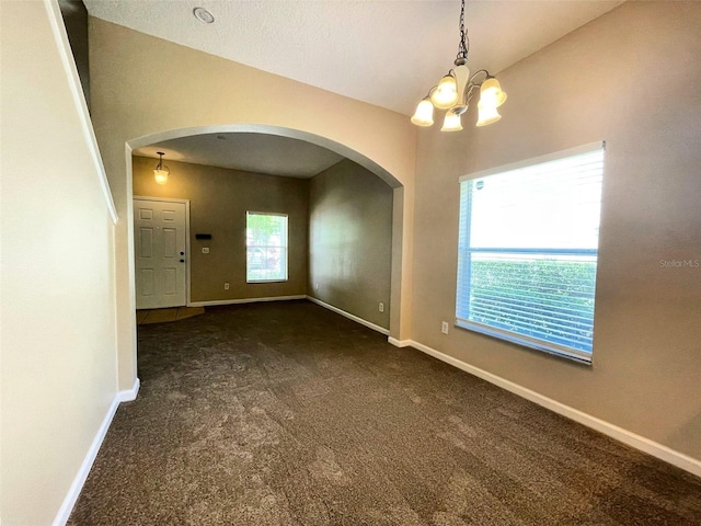 10303 Park Commons Dr, Orlando, FL 32832 - unfurnished room with arched walkways, a chandelier, carpet, and baseboards