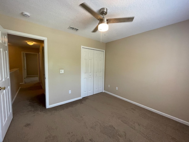 10303 Park Commons Dr, Orlando, FL 32832 - unfurnished bedroom with baseboards, carpet floors, a closet, a textured ceiling, and ceiling fan