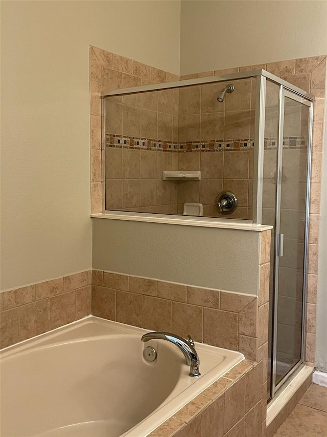 10303 Park Commons Dr, Orlando, FL 32832 - bathroom featuring a stall shower and a garden tub