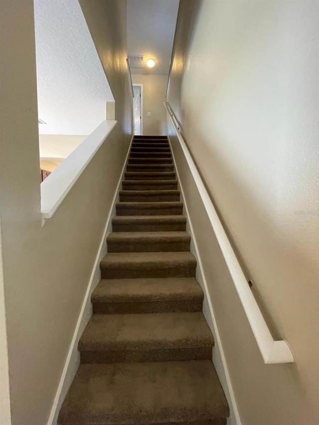 10303 Park Commons Dr, Orlando, FL 32832 - staircase featuring baseboards