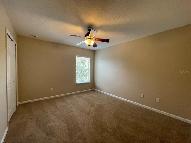 10303 Park Commons Dr, Orlando, FL 32832 - unfurnished bedroom featuring light colored carpet, baseboards, ceiling fan, a closet, and a textured ceiling