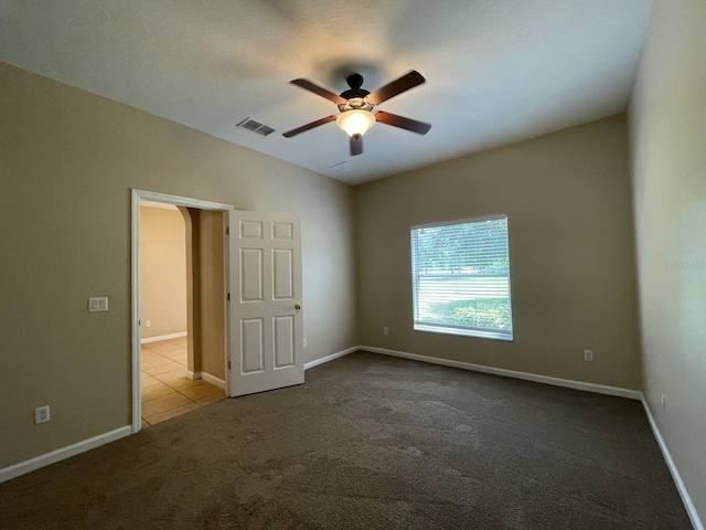 10303 Park Commons Dr, Orlando, FL 32832 - spare room with ceiling fan, carpet, vaulted ceiling, and baseboards