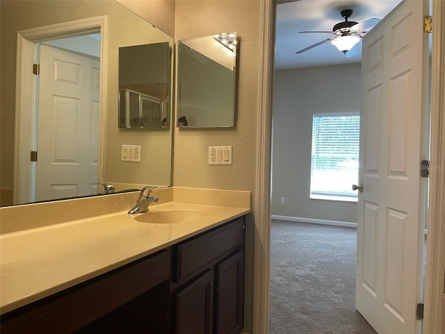 10303 Park Commons Dr, Orlando, FL 32832 - bathroom with vanity, baseboards, and a ceiling fan