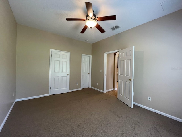 10303 Park Commons Dr, Orlando, FL 32832 - unfurnished bedroom featuring carpet, baseboards, and a ceiling fan
