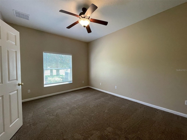 10303 Park Commons Dr, Orlando, FL 32832 - spare room with dark carpet, a ceiling fan, and baseboards