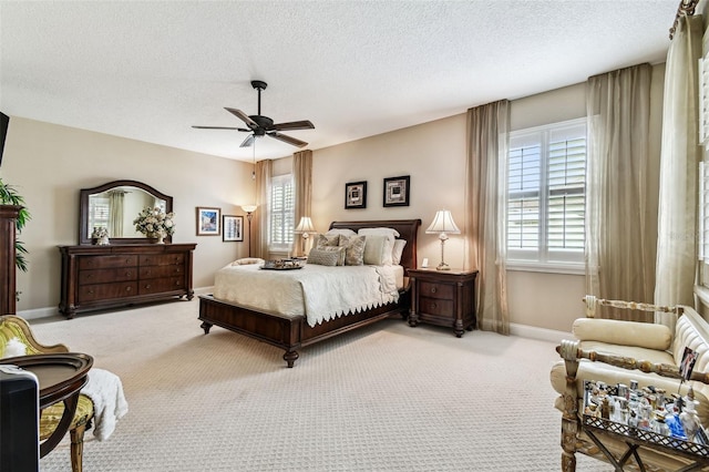 3302 Granite Ridge Loop, Land O Lakes, FL 34638 - carpeted bedroom with a textured ceiling, baseboards, and ceiling fan